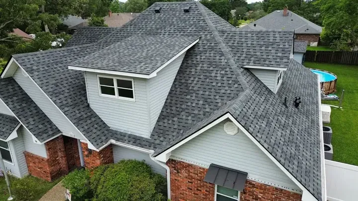 Aerial view of a multi-gable residential shingle roof inspected by Cypress Roofing